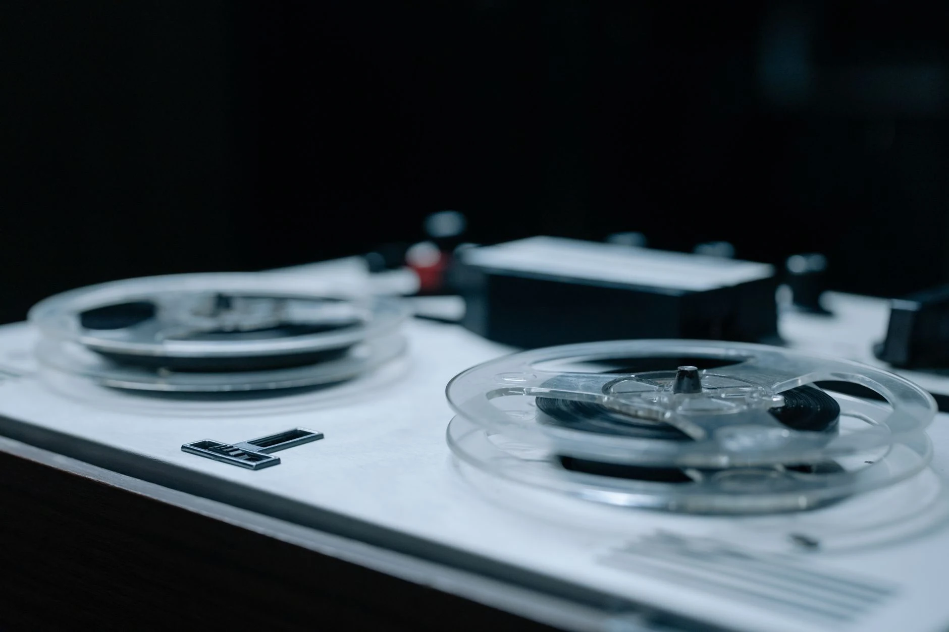 Detailed view of a vintage reel-to-reel tape recorder showcasing classic design and equipment.