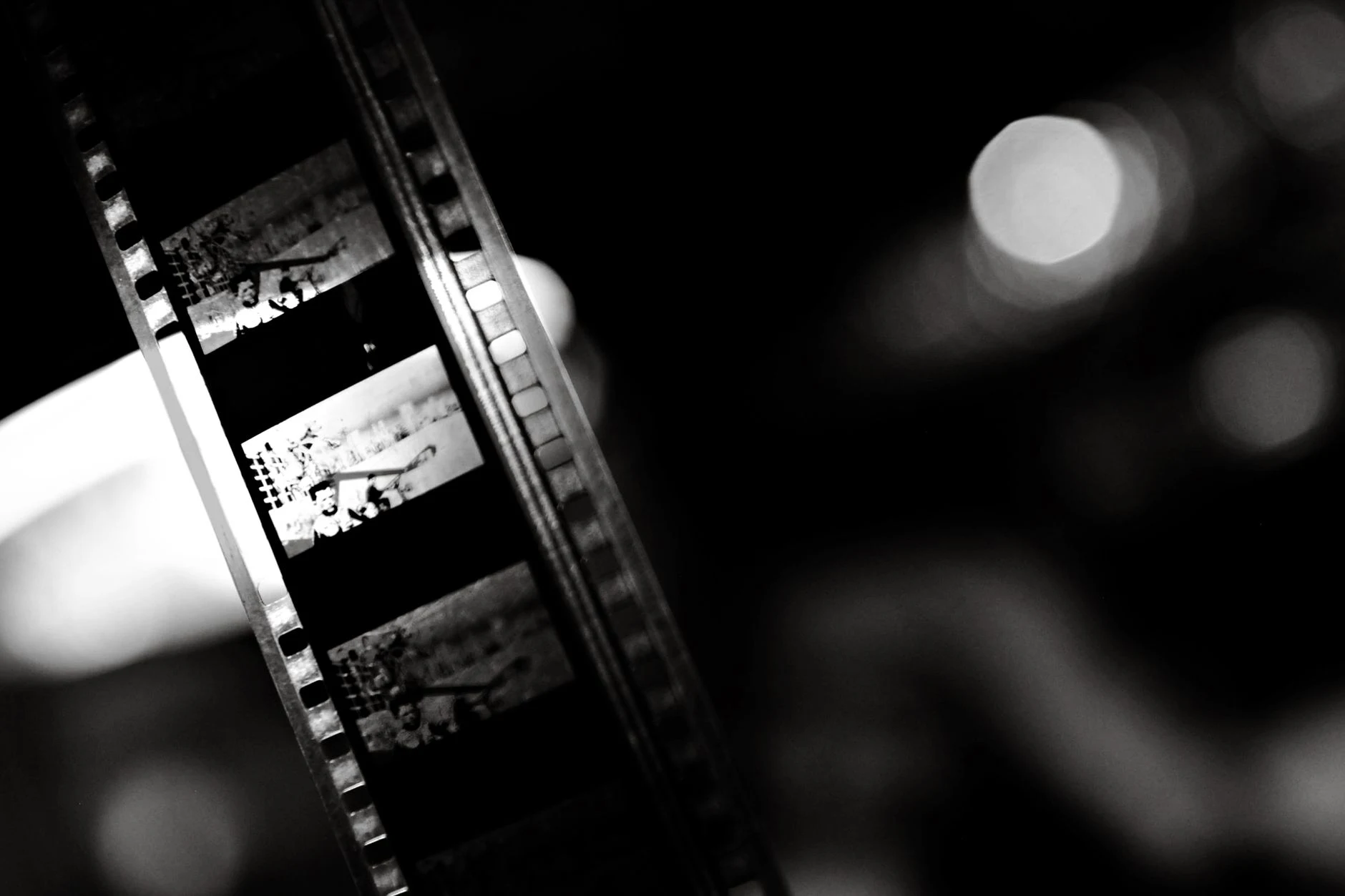 A close-up of a vintage film strip in black and white, capturing the essence of classic cinema.